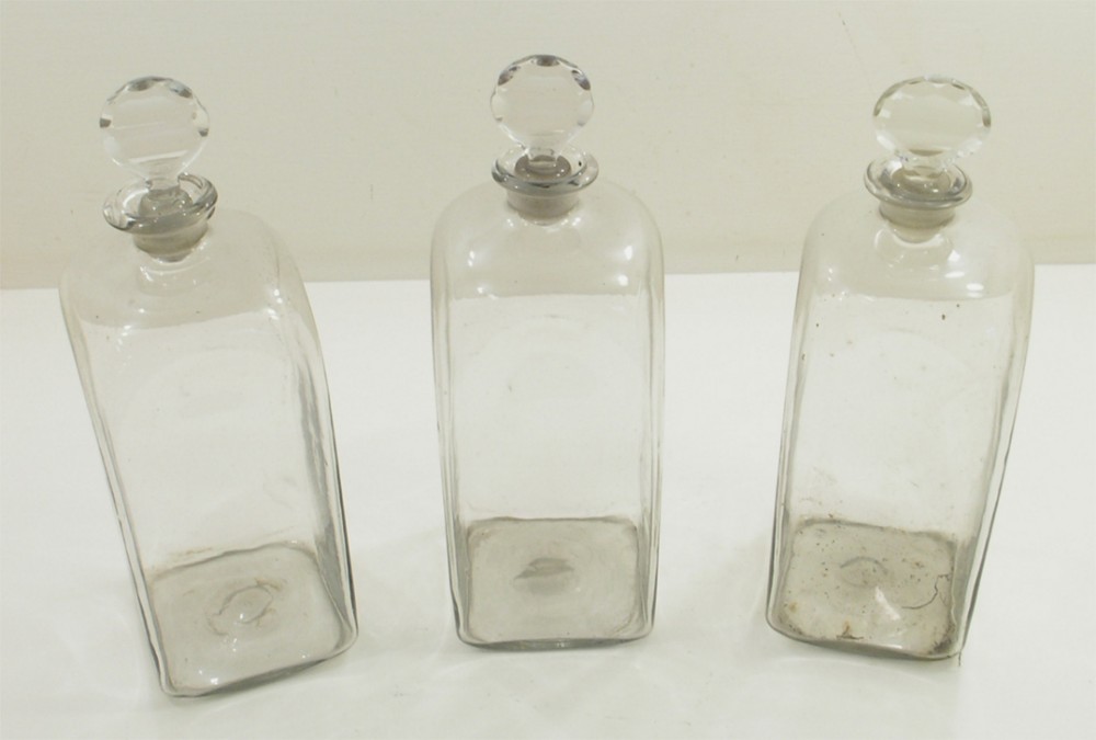 RARE SET OF THREE MID GEORGIAN GLASS DECANTERS