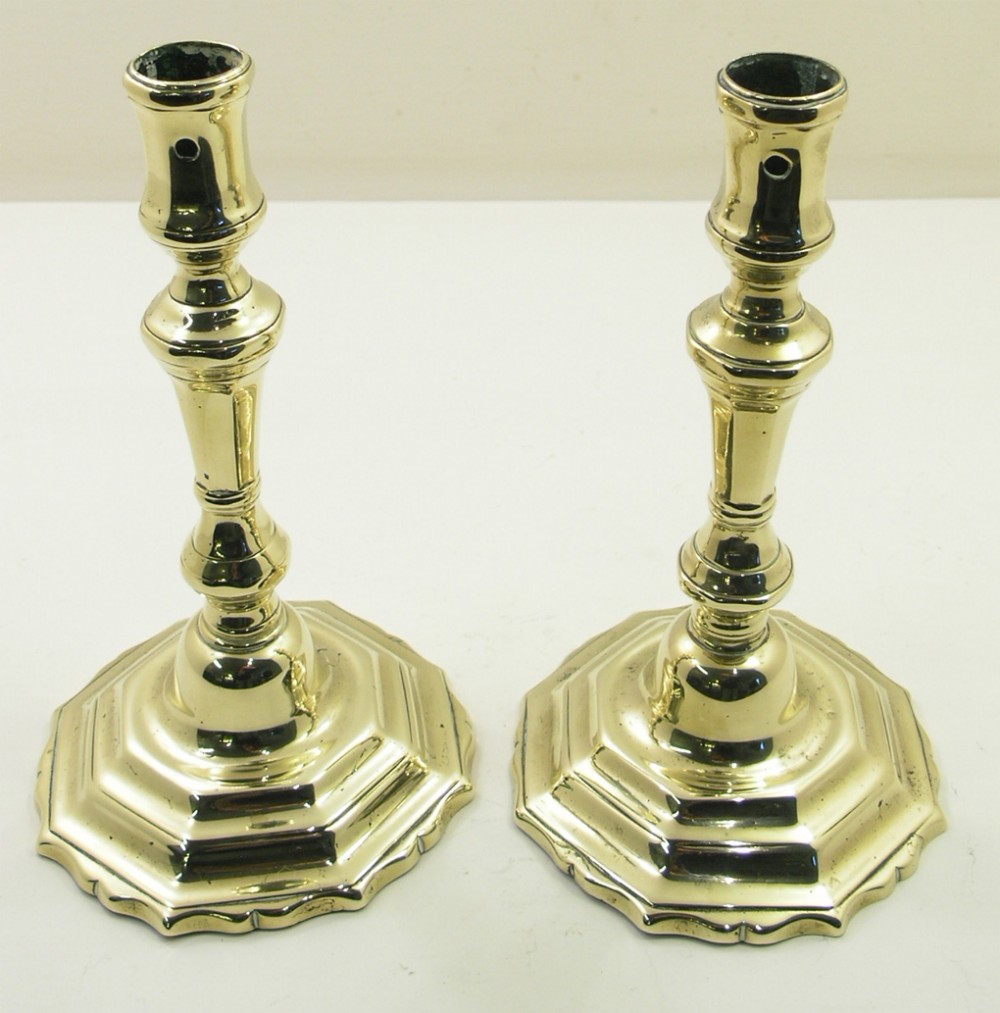 RARE PAIR OF QUEEN ANNE BRASS CANDLESTICKS. C. 1720