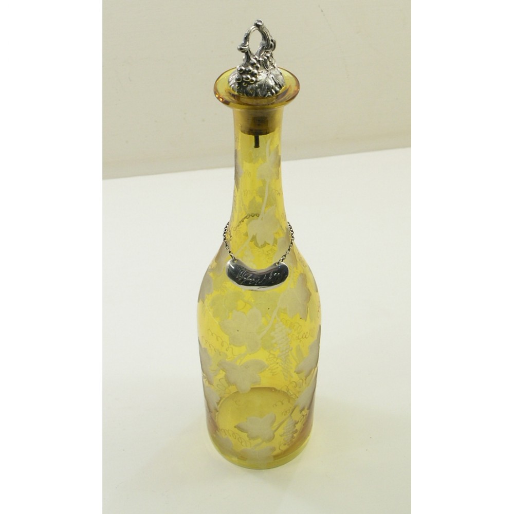 BEAUTIFUL AMBER GLASS DECANTER WITH SILVER LABEL.