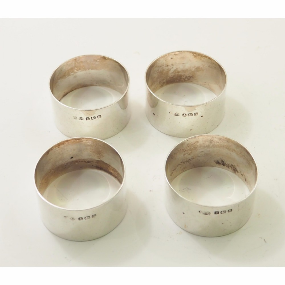 SET OF 4 STERLING SILVER NAPKIN RINGS. 1941
