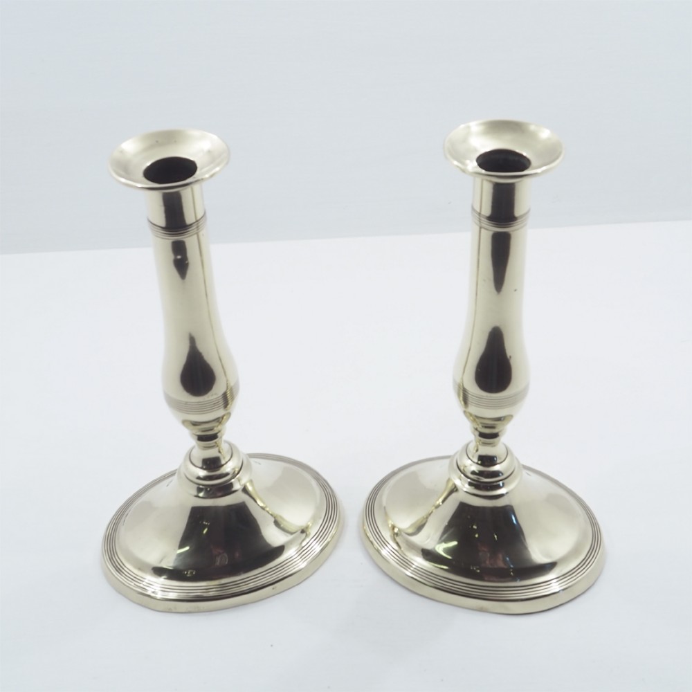 ELEGANT PAIR OF GEOGIAN BRASS CANDLESTICKS
