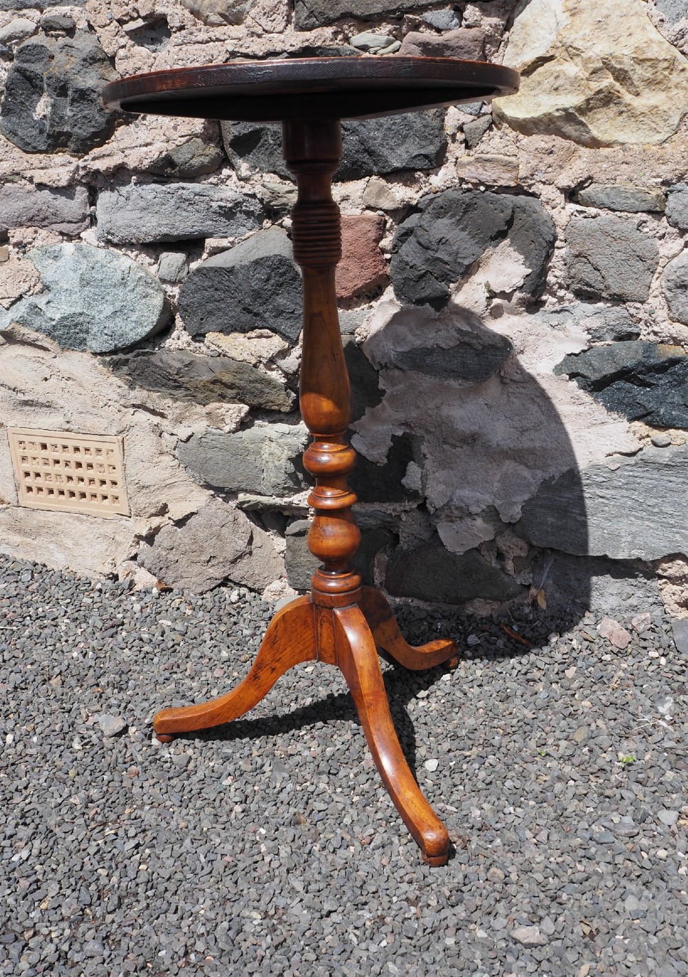 A Georgian burr elm tripod table featuring a circular top, turned pedestal column, and three splayed legs. View II