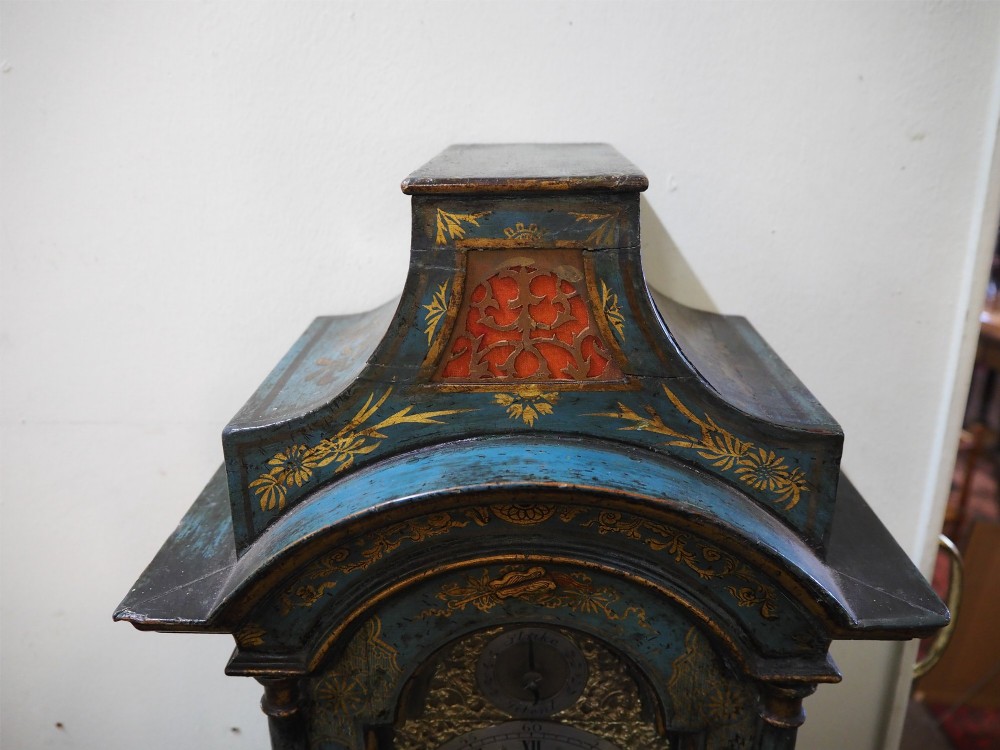 A blue lacquered grandmother clock decorated with gilt chinoiserie figural scenes and an arched brass dial. View VIII