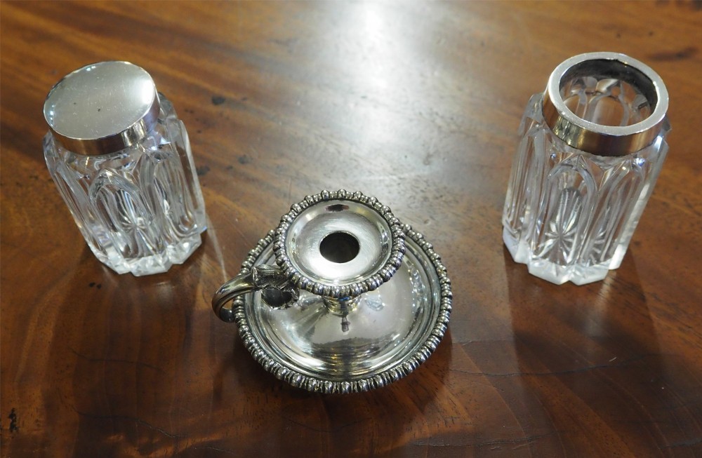 An antique silver-plated rectangular desk tray featuring a pierced gallery edge, two cut glass inkwells, a central taper holder, and a recessed pen groove. View VIII