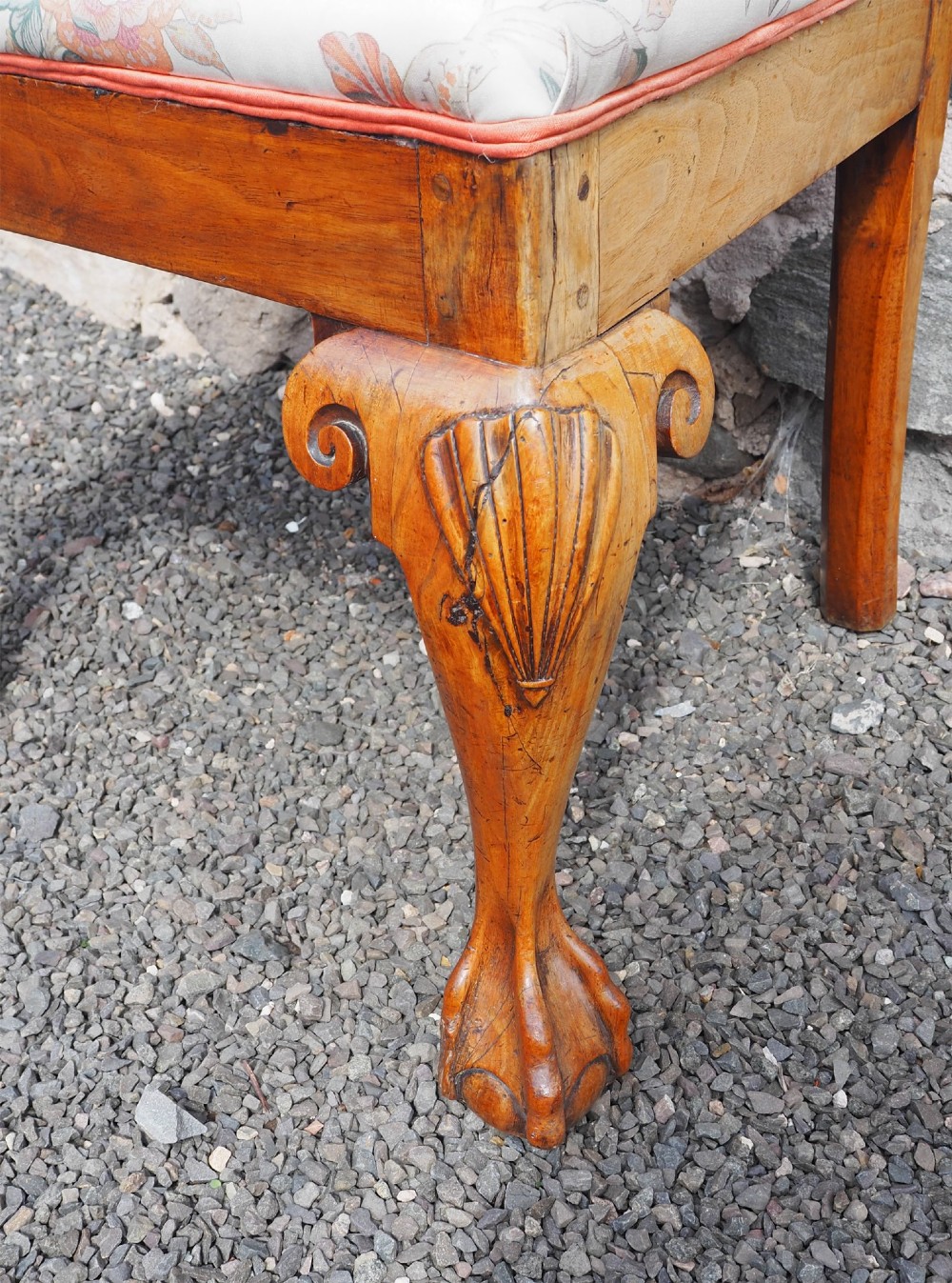 An antique George II walnut side chair with a pierced splat back, floral upholstered seat, and cabriole front legs ending in carved ball and claw feet. View VI