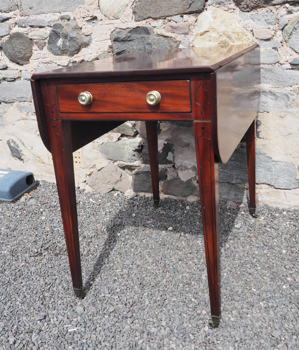 An 18th-century mahogany Pembroke table featuring two drop-leaf flaps, a single end drawer with brass knobs, and square tapered legs with subtle line inlay. View II