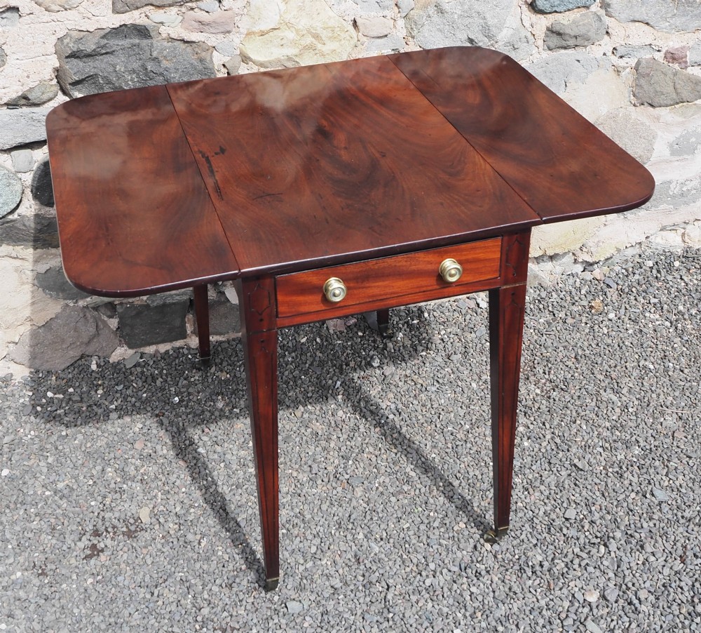 An 18th-century mahogany Pembroke table featuring two drop-leaf flaps, a single end drawer with brass knobs, and square tapered legs with subtle line inlay. View III