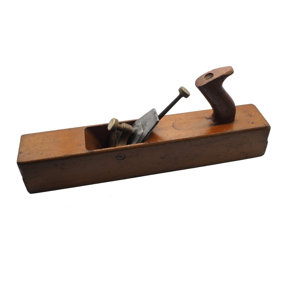 An antique wooden panel plane featuring a beech body, shaped rear handle, steel cutting iron, and brass adjustment mechanism. View II