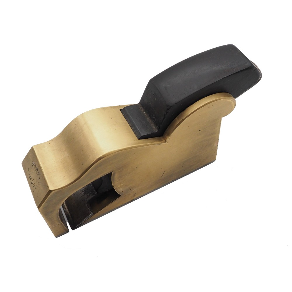 A Norris London No. 27 gunmetal bullnose woodworking plane featuring a polished brass body, stamped maker mark, and dark wooden wedge.