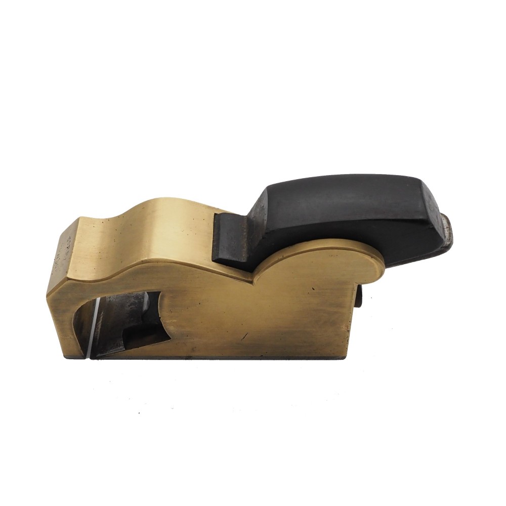 A Norris London No. 27 gunmetal bullnose woodworking plane featuring a polished brass body, stamped maker mark, and dark wooden wedge. View III