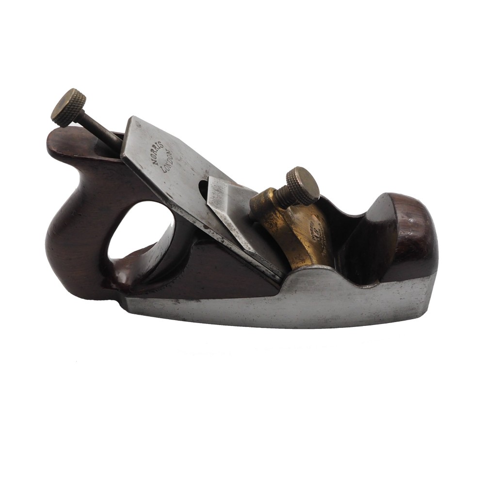 A Norris London A5 patent adjustable smoothing plane with a cast steel body, dark hardwood infill, and brass lever cap. View II