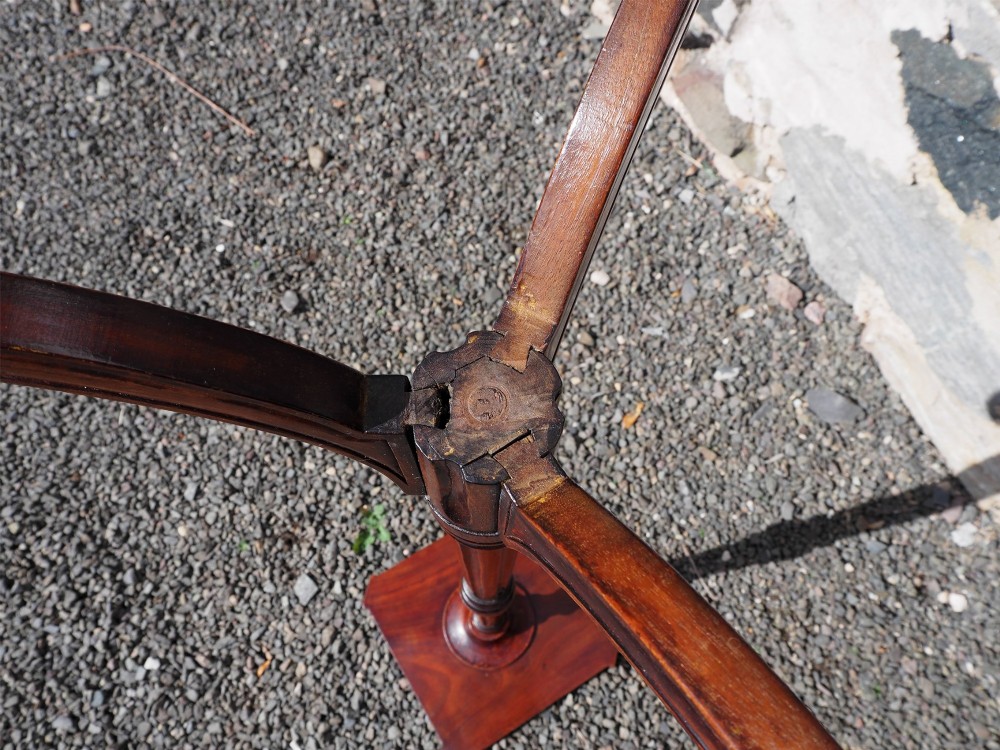 An 18th-century Dutch walnut torchere featuring a turned tapered column, shaped square tray top, and carved tripod legs. View VIII