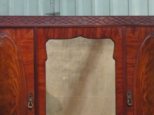 fig 2. ANTIQUE FLAMED MAHOGANY CHIPPENDALE TRIPLE WARDROBE BY MAPLES & CO C1910