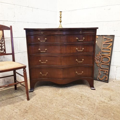 Antique Mahogany Serpentine Shaped Chest of Drawers with Brushing Slide C1920