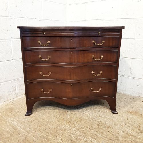 fig 1. ANTIQUE MAHOGANY SERPENTINE SHAPED CHEST OF DRAWERS WITH BRUSHING SLIDE C1920