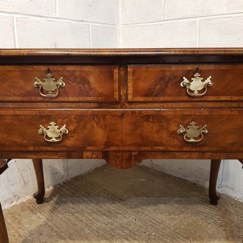 fig 2. AN ANTIQUE BURR WALNUT LOWBOY BY WARING S GILLOWS STAMPED C1920