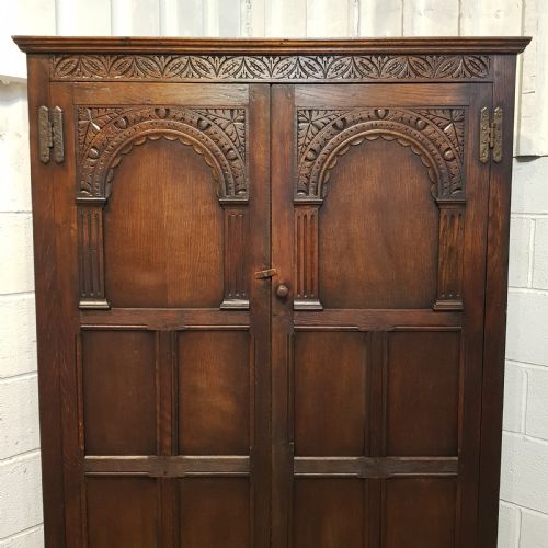 fig 2. AN ANTIQUE OAK CARVED DOUBLE WARDROBE C1920