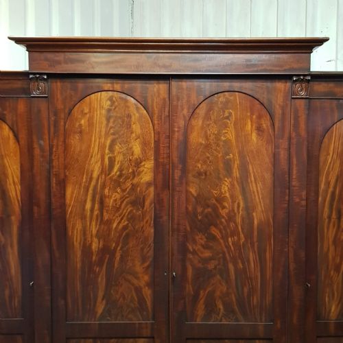 fig 1. A WILLIAM 4th MAHOGANY FOUR DOOR BREAKFRONT TRIPLE WARDROBE C1830