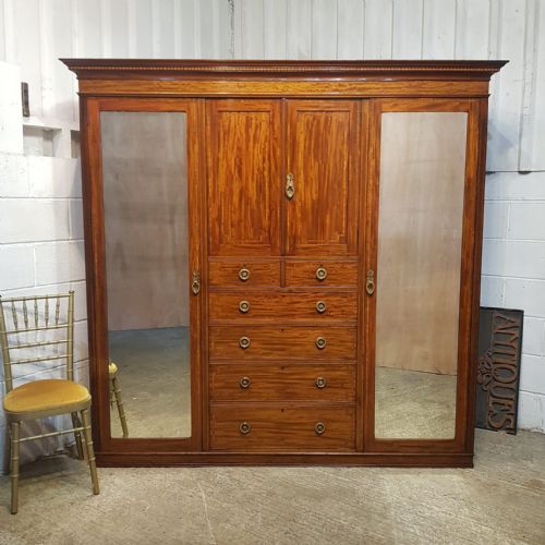 An Edwardian Mahogany Triple Wardrobe by Maples C1900