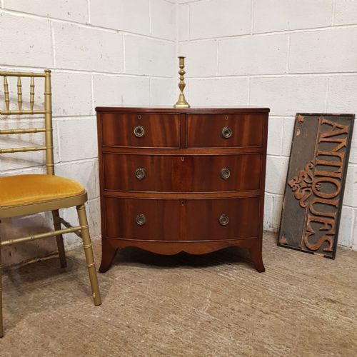 A Small Walnut Bow Fronted Chest of Drawers C1920