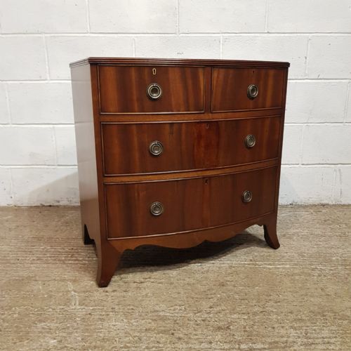 fig 1. A SMALL WALNUT BOW FRONTED CHEST OF DRAWERS C1920