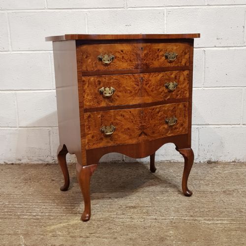 fig 1. A SMALL BURR WALNUT SERPENTINE FRONTED CHEST OF DRAWERS C1920