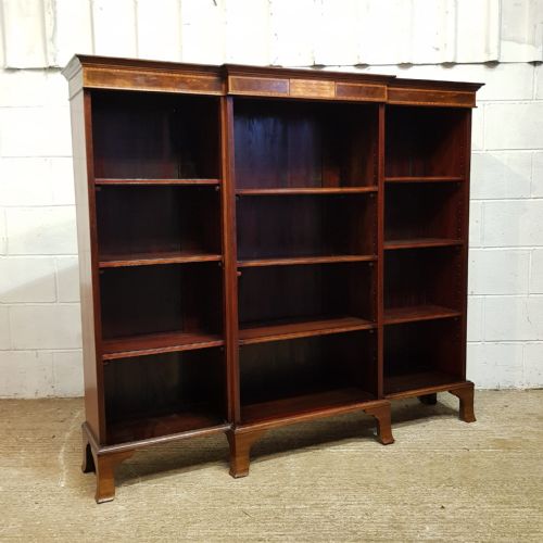 fig 1. AN EDWARDIAN MAHOGANY BREAKFRONT OPEN BOOKCASE C1890