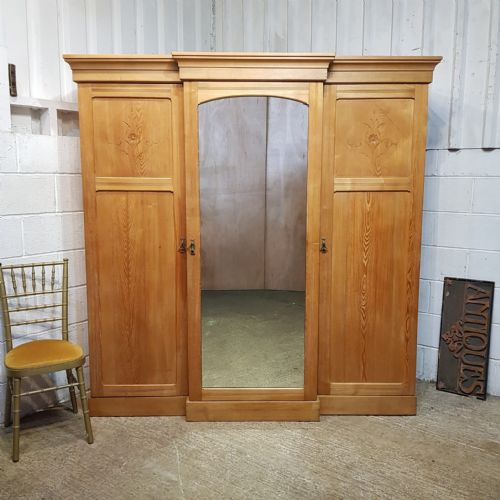 An Antique Ash Breakfront Triple Wardrobe C1900