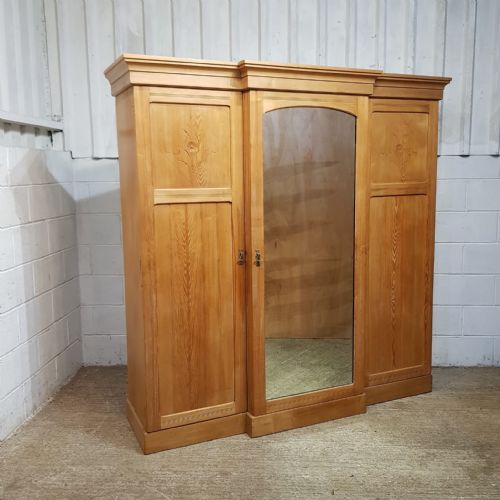 fig 1. AN ANTIQUE ASH BREAKFRONT TRIPLE WARDROBE C1900