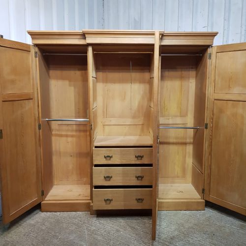 fig 2. AN ANTIQUE ASH BREAKFRONT TRIPLE WARDROBE C1900