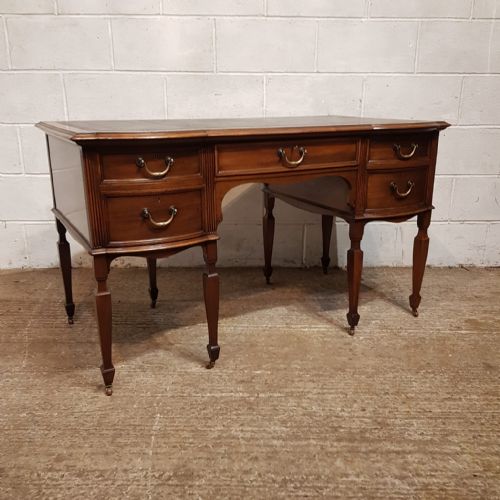 fig 1. A LARGE EDWARDIAN MAHOGANY SERPENTINE FRONTED DESK C1900