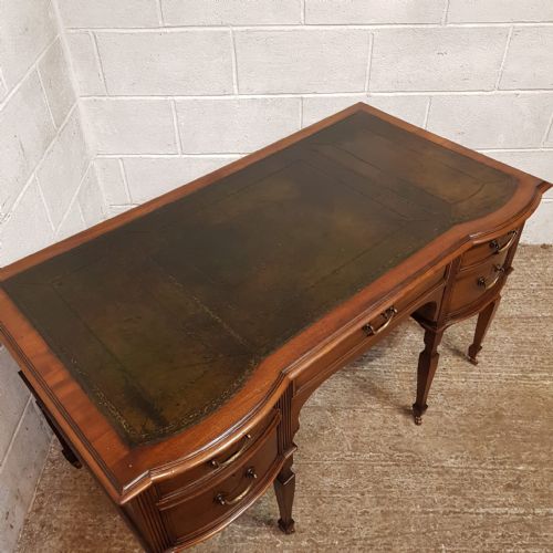fig 2. A LARGE EDWARDIAN MAHOGANY SERPENTINE FRONTED DESK C1900