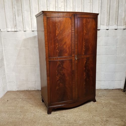 fig 1. A BOW FRONTED MAHOGANY TRIPLE WARDROBE C1920