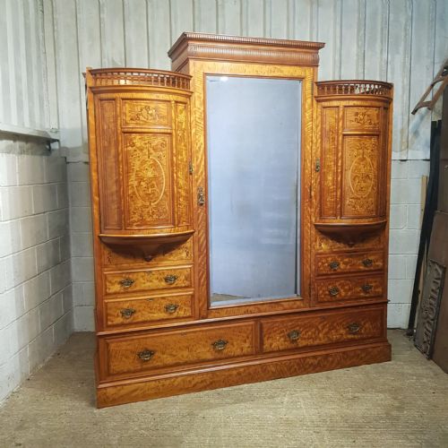 fig 1. A SATINWOOD HEAVILY INLAID TRIPLE WARDROBE BY SHAPLAND AND PETTER OF BARNSTABLE C1890
