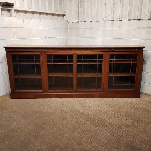 An Edwardian Long Low Glazed Bookcase with Book Rest C1900