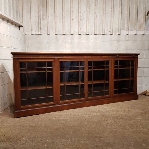 fig 1. AN EDWARDIAN LONG LOW GLAZED BOOKCASE WITH BOOK REST C1900
