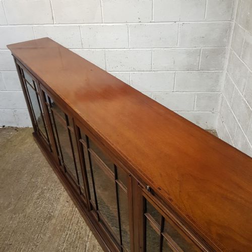 fig 2. AN EDWARDIAN LONG LOW GLAZED BOOKCASE WITH BOOK REST C1900