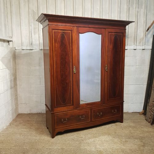 fig 2. AN EDWARDIAN MAHOGANY INLAID TRIPLE WARDROBE C1900