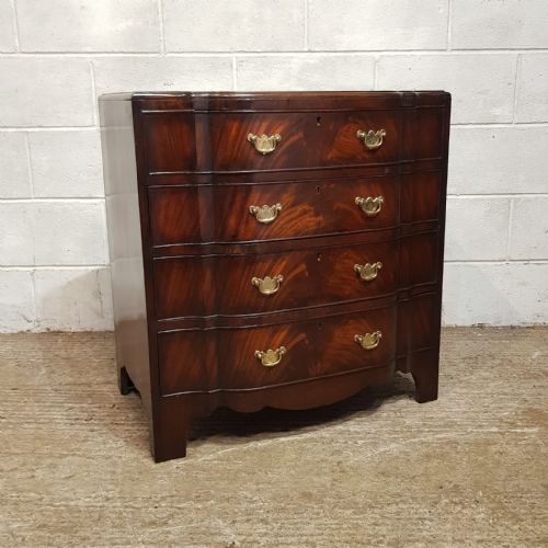fig 1. A MAHOGANY SERPENTINE FRONTED DRESSING CHEST WITH MIRROR C1920