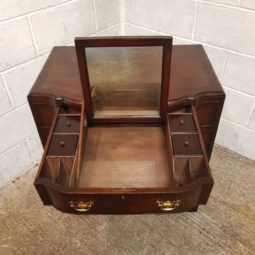 fig 2. A MAHOGANY SERPENTINE FRONTED DRESSING CHEST WITH MIRROR C1920