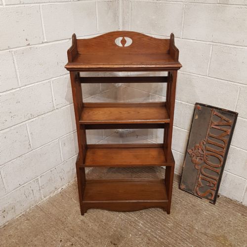 AN ARTS AND CRAFTS OPEN OAK BOOKCASE C1900
