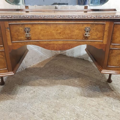 fig 1. A QUEEN ANNE STYLE SERPENTINE FRONTED BURR WALNUT DRESSING TABLE C1920