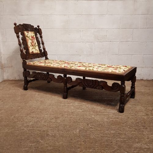 A VICTORIAN CARVED OAK DAYBED C1880
