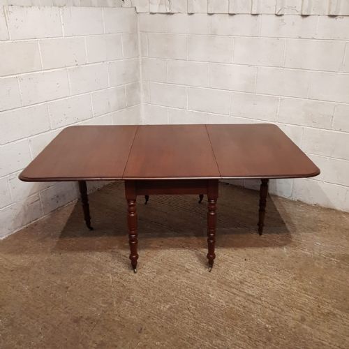 A REGENCY MAHOGANY DROP LEAF DINING TABLE C1820