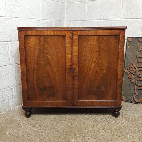 A REGENCY MAHOGANY LOW CUPBOARD C1820