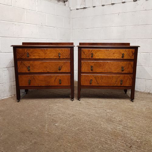 fig 2. A matching pair of three-drawer chests crafted from walnut with prominent burr walnut veneer drawer fronts and low gallery backs.