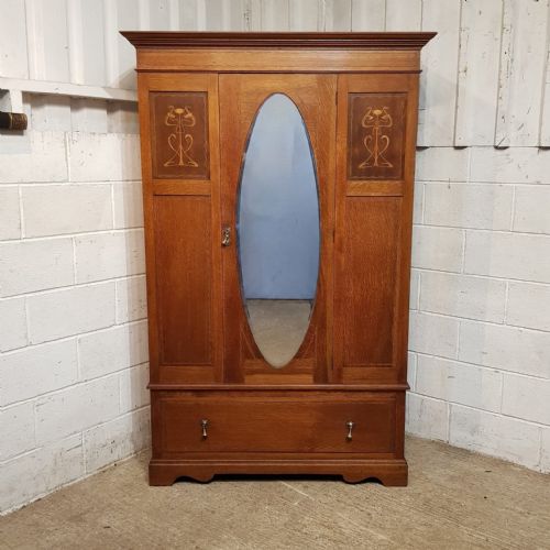 An Arts & Crafts Oak Wardrobe C!900