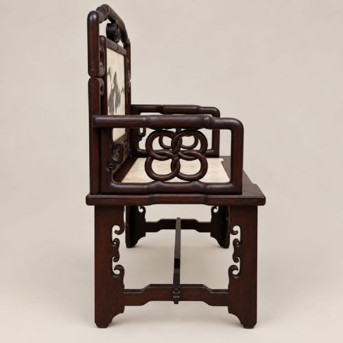 fig 1. A late Qing dynasty Chinese dark hardwood armchair featuring an inlaid mottled marble backrest panel and seat.