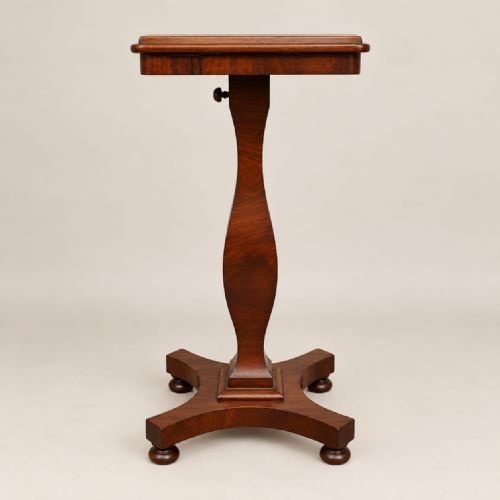 fig 2. A Victorian mahogany music stand featuring an adjustable tilted rest, a turned shaped stem, and a quadform base with turned feet.