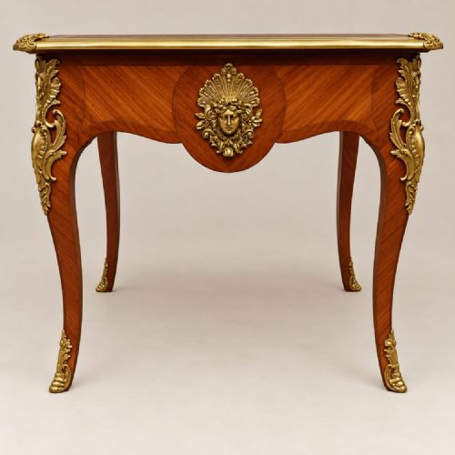 fig 2. An antique French Louis XV style kingwood bureau plat writing desk featuring parquetry veneering, cabriole legs, and gilt-bronze ormolu mounts.